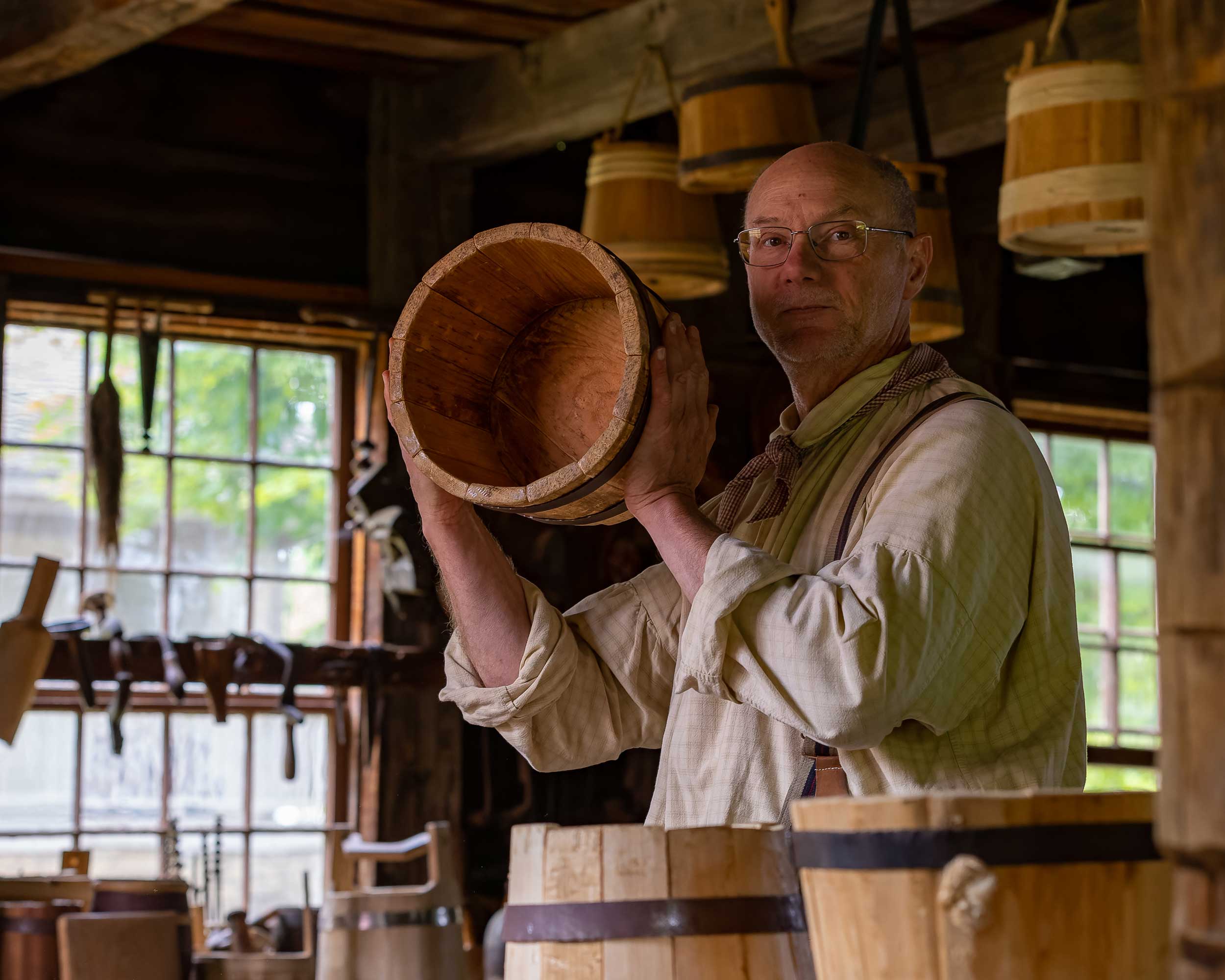 man holding a barrel