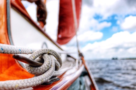 close up of rope on a wooden boat